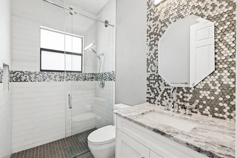 a view of walk in closet with clothes