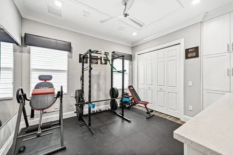 a bathroom with a granite countertop sink toilet a mirror a vanity and shower