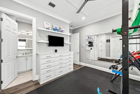 a spacious bathroom with a granite countertop sink a toilet and a shower