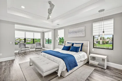 a view of a workspace with furniture and wooden floor