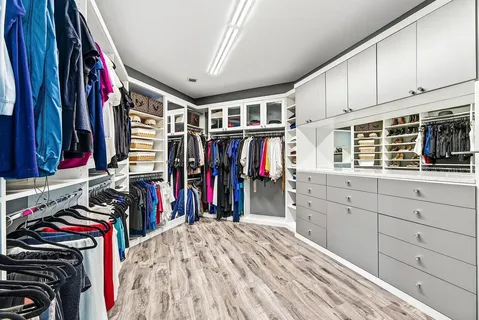 a living room with a bed furniture and a window