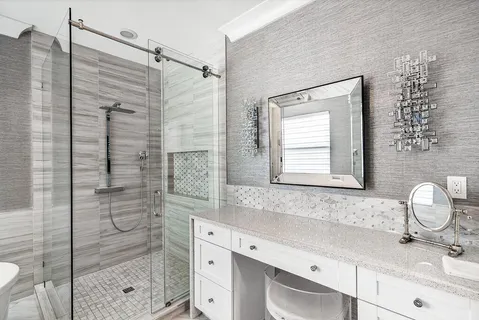 a view of a lake with houses in the back