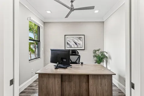 an aerial view of residential houses with outdoor space and lake view