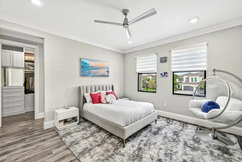 an aerial view of a house with a garden and swimming pool