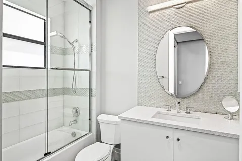 an aerial view of residential houses with outdoor space and street view