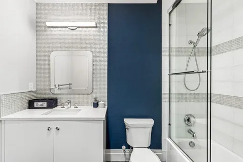 a kitchen with stainless steel appliances kitchen island granite countertop a table and chairs