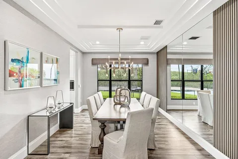 a large kitchen with stainless steel appliances granite countertop a stove oven and a sink