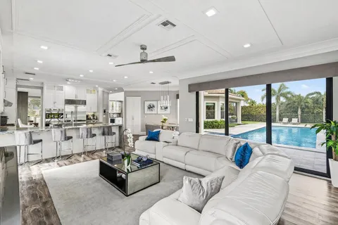 a kitchen with refrigerator and cabinets
