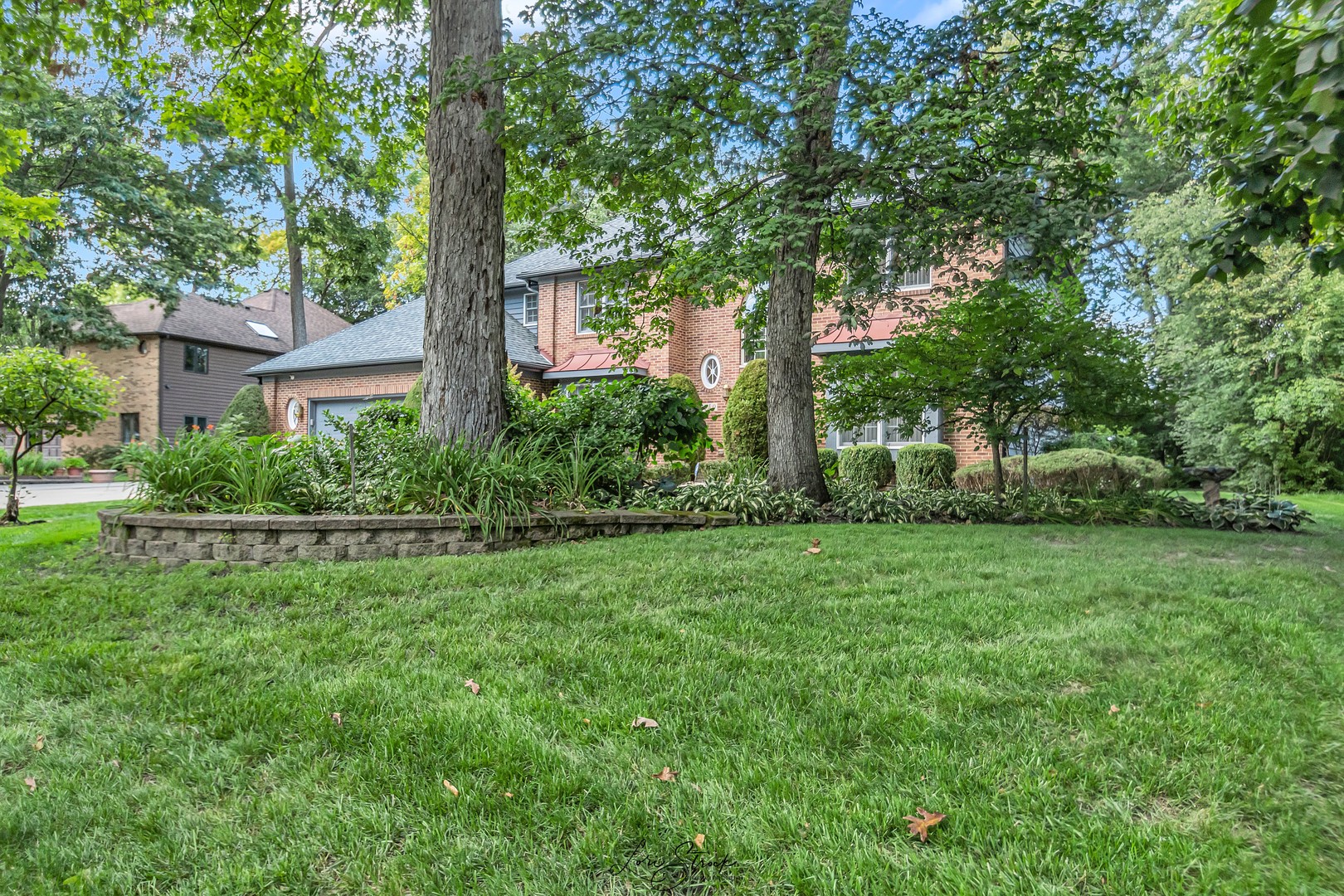 640 Ford Lane Bartlett, IL 60103 - Photo 12 of 46 a view of a yard with plants and trees