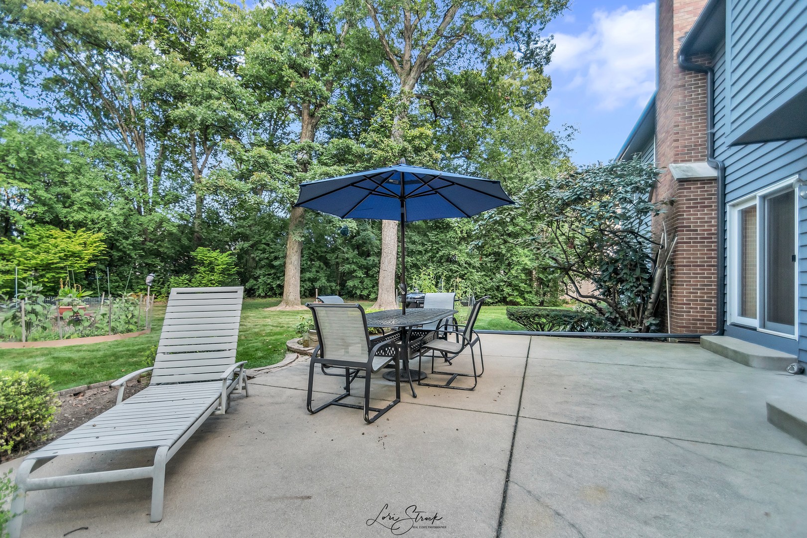 640 Ford Lane Bartlett, IL 60103 - Photo 15 of 46 a view of a patio with a table and chairs under an umbrella