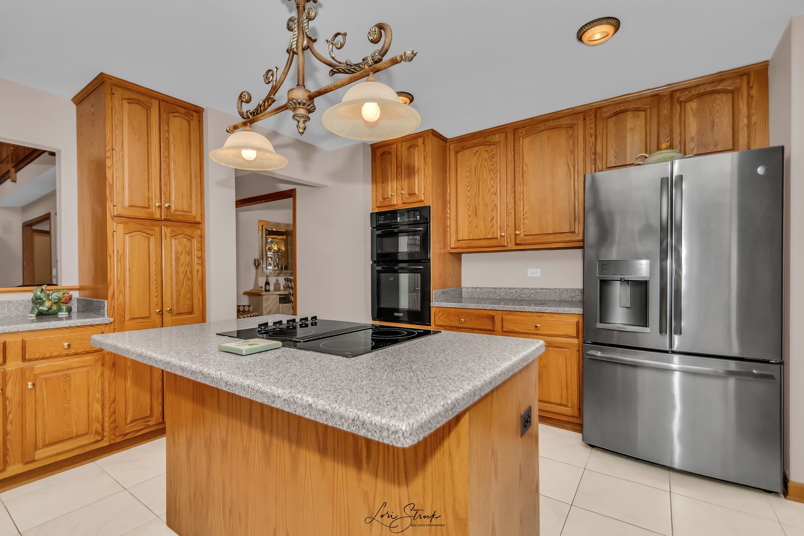640 Ford Lane Bartlett, IL 60103 - Photo 29 of 46 a kitchen with refrigerator and cabinets