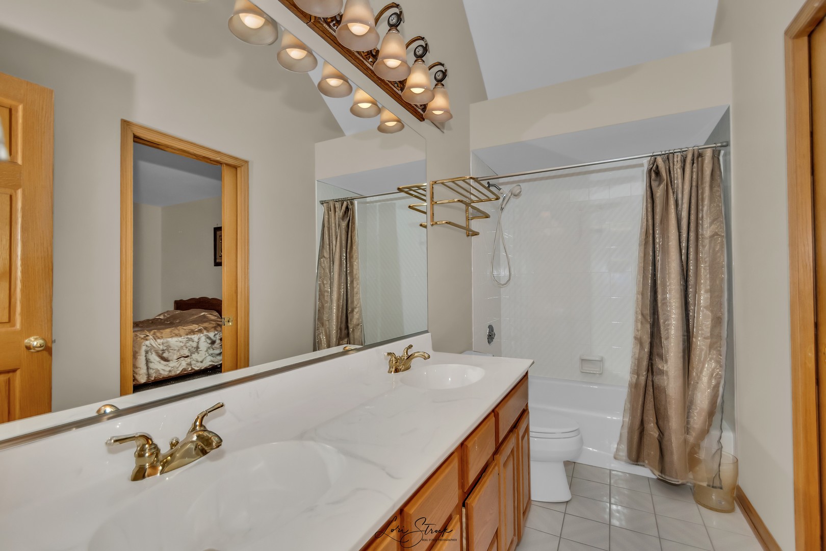 640 Ford Lane Bartlett, IL 60103 - Photo 38 of 46 a bathroom with a granite countertop sink a mirror and shower