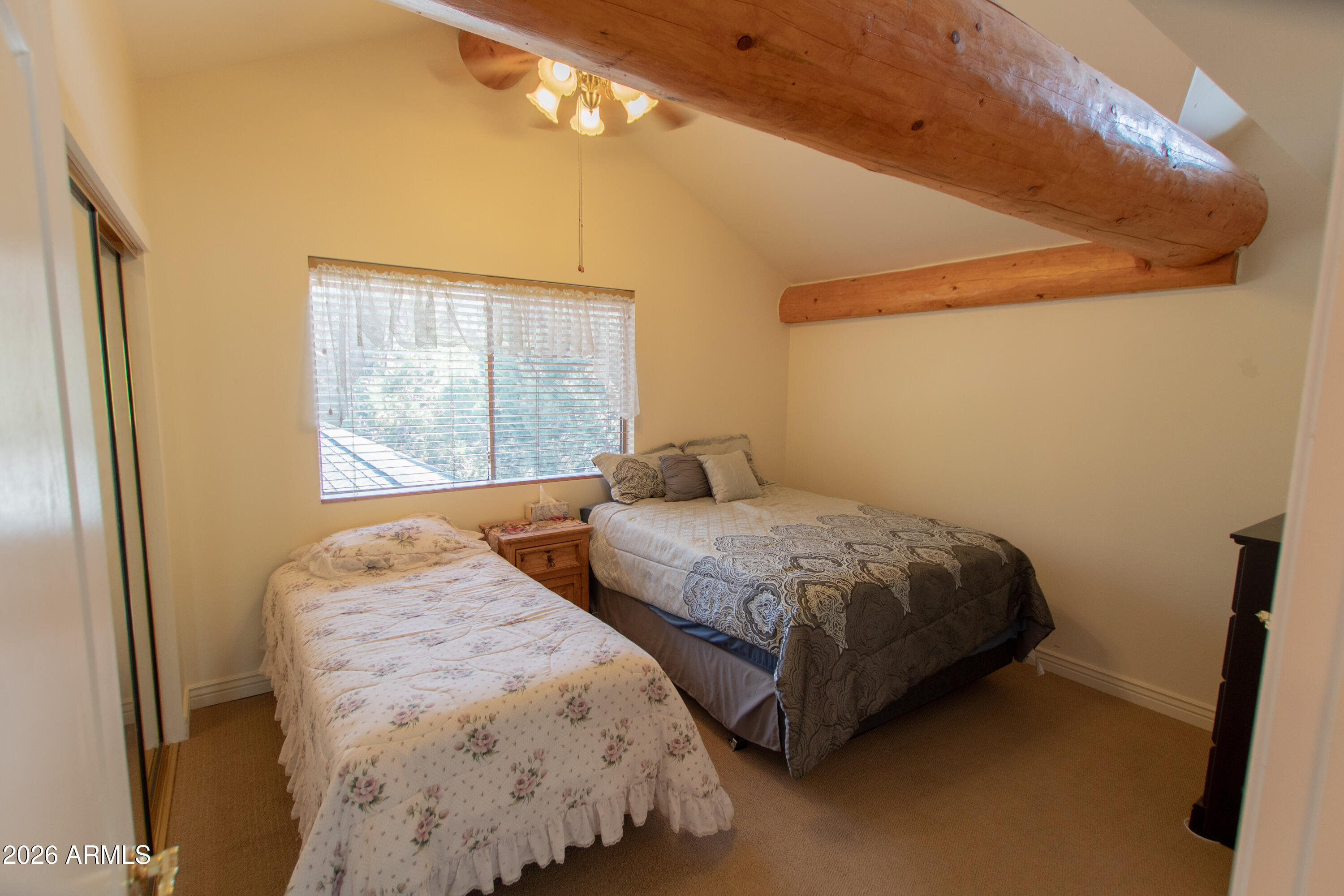 6168 Hidden Pines Loop Pine, AZ 85544 - Photo 17 of 25 a bedroom with two beds and painted walls