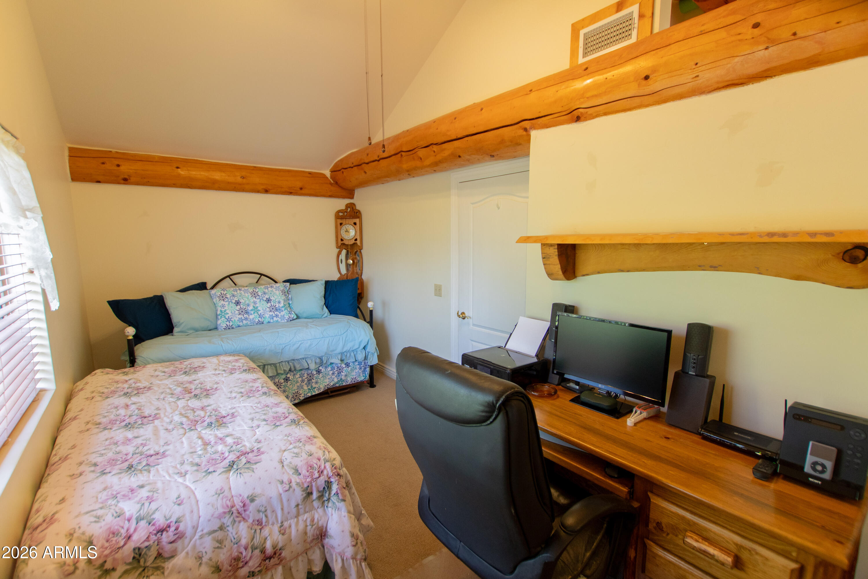 6168 Hidden Pines Loop Pine, AZ 85544 - Photo 19 of 25 a bedroom with furniture and a window