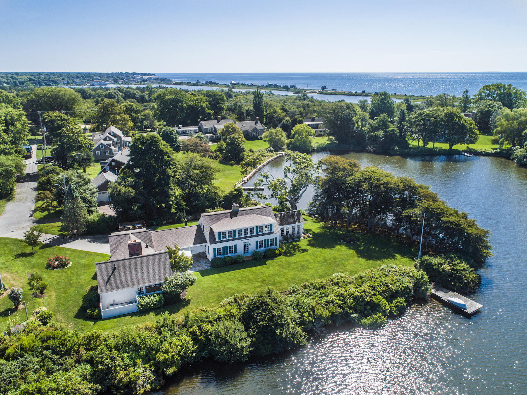 67 Quonset Road Falmouth, MA 02540 - Photo 1 of 55 an aerial view of a house with a garden and lake view
