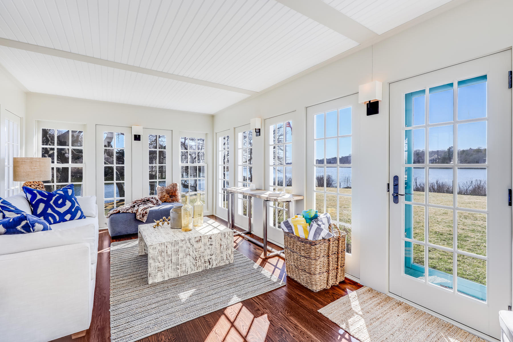 67 Quonset Road Falmouth, MA 02540 - Photo 12 of 55 a living room with furniture and a floor to ceiling window