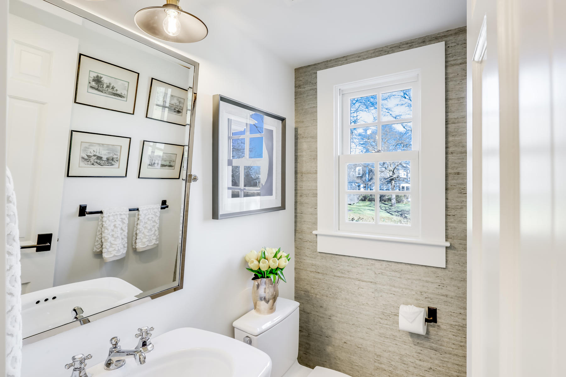 67 Quonset Road Falmouth, MA 02540 - Photo 16 of 55 a bathroom with a toilet sink and mirror