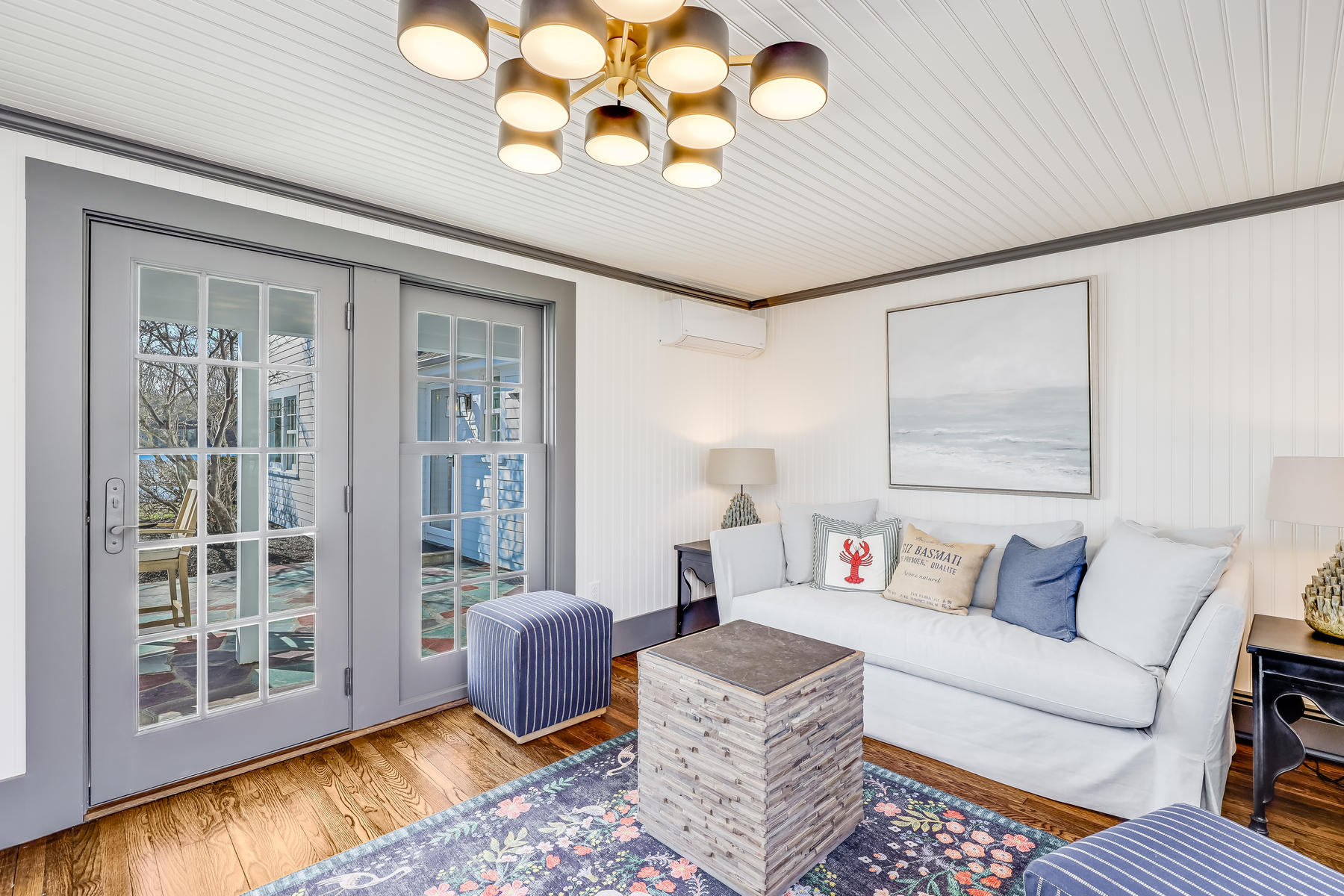 67 Quonset Road Falmouth, MA 02540 - Photo 23 of 55 a living room with furniture and a large window