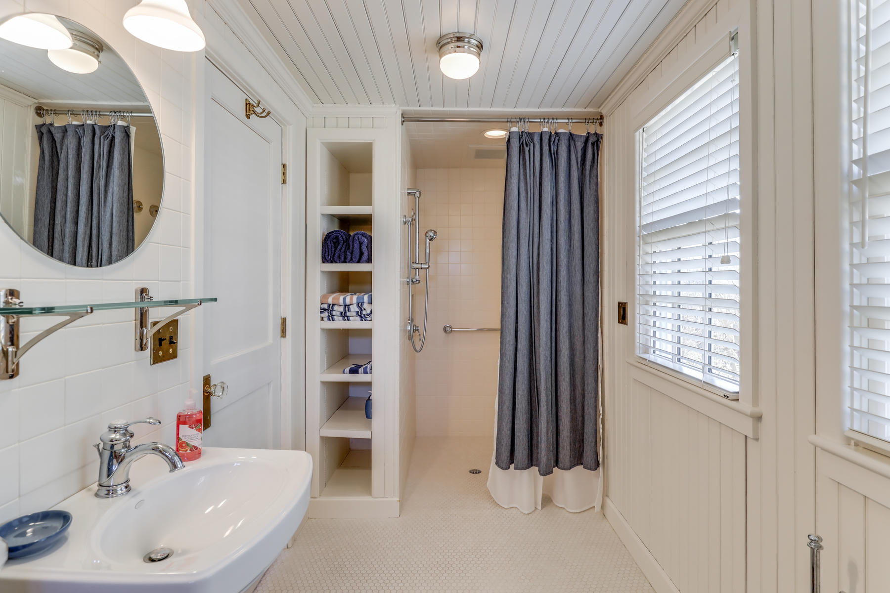 67 Quonset Road Falmouth, MA 02540 - Photo 29 of 55 a bathroom with a sink a toilet and shower