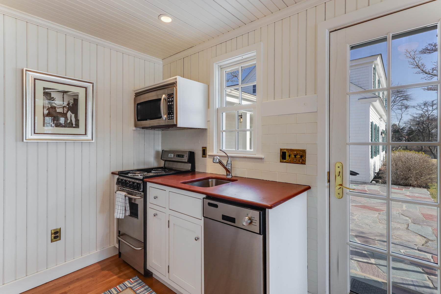 67 Quonset Road Falmouth, MA 02540 - Photo 30 of 55 a kitchen that has a sink and a stove in it