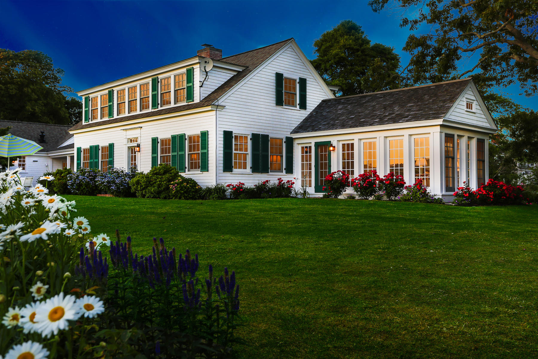 67 Quonset Road Falmouth, MA 02540 - Photo 3 of 55 a front view of a house with a garden and plants