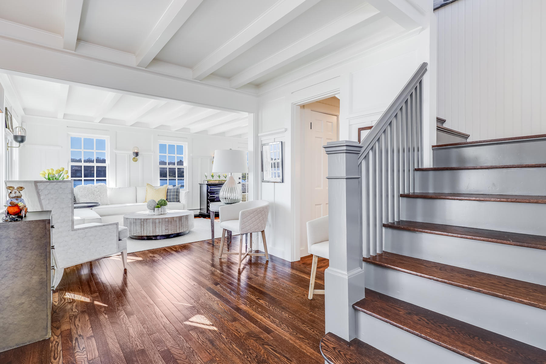67 Quonset Road Falmouth, MA 02540 - Photo 31 of 55 a living room with furniture and a wooden floor