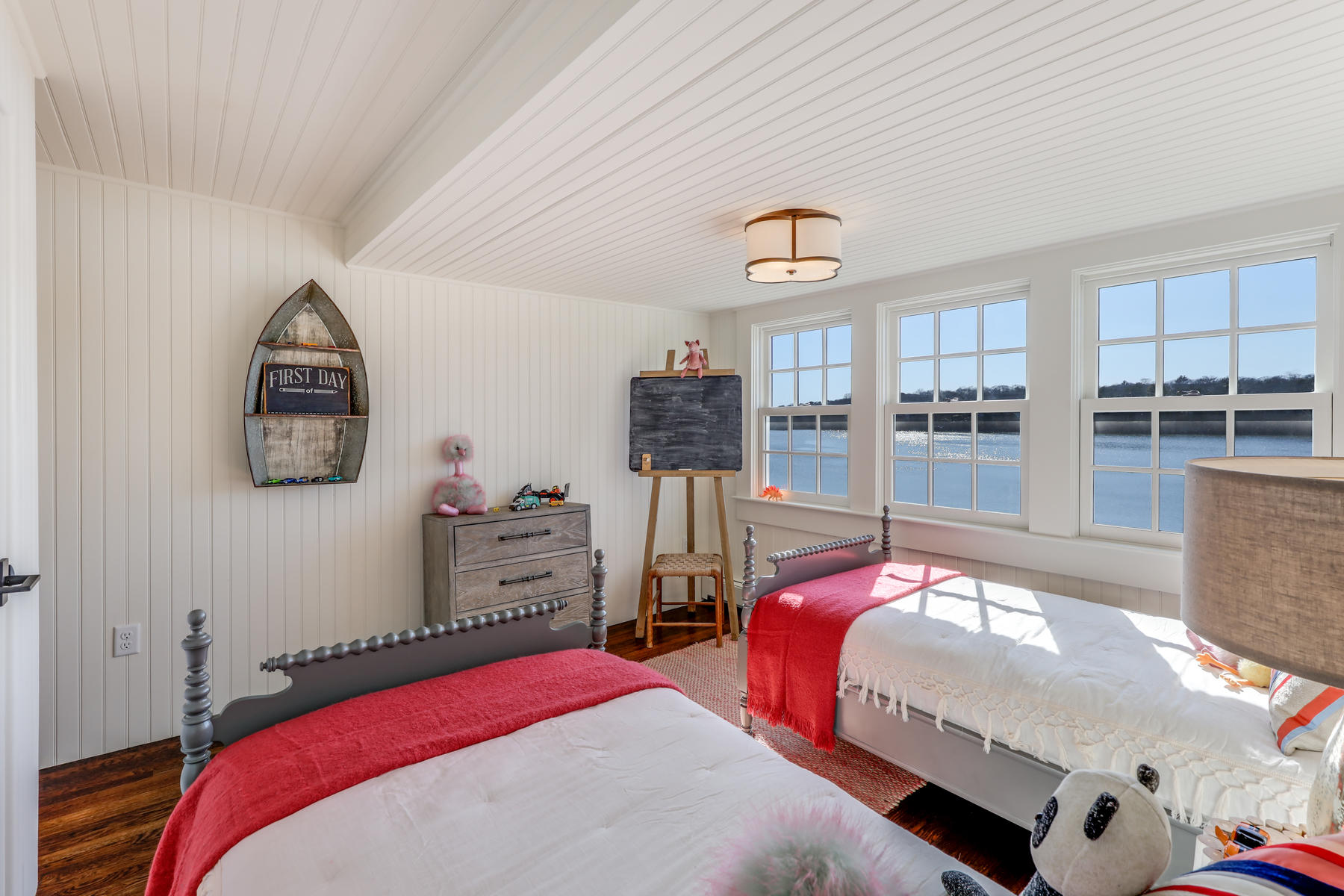 67 Quonset Road Falmouth, MA 02540 - Photo 36 of 55 a bedroom with a bed and wooden floor