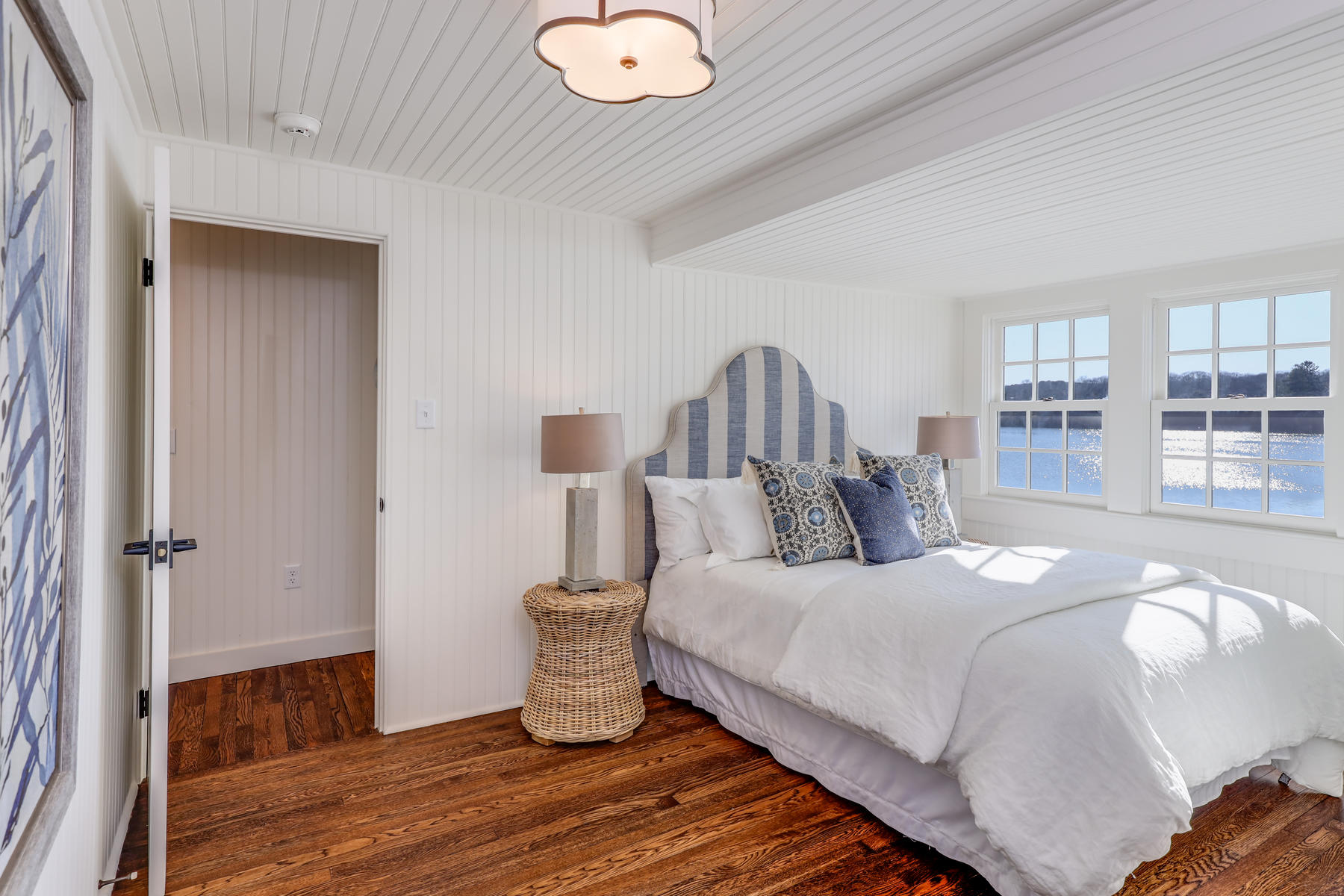 67 Quonset Road Falmouth, MA 02540 - Photo 40 of 55 a bedroom with a bed and wooden floor