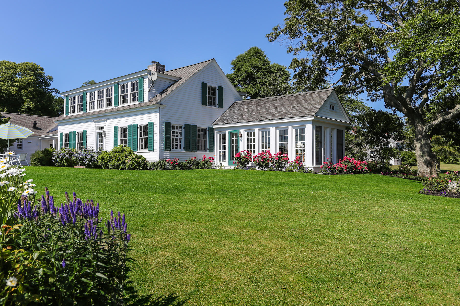 67 Quonset Road Falmouth, MA 02540 - Photo 41 of 55 a front view of house with yard and green space