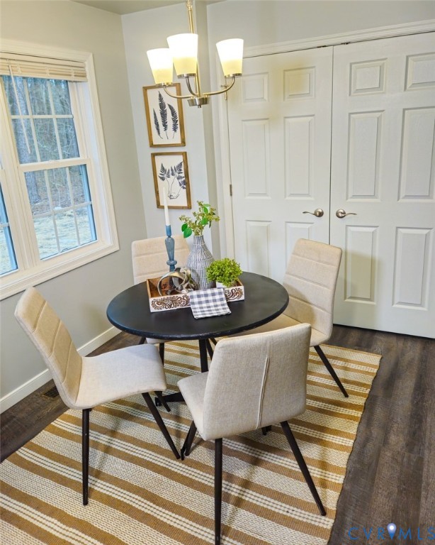 450 Wyatts Mill Road Jarratt, VA 23867 - Photo 11 of 16 a view of a dining room with furniture and wooden floor