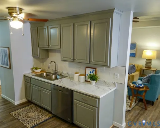 a kitchen with a sink cabinets and utility