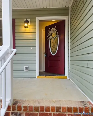 a view of a door and a window