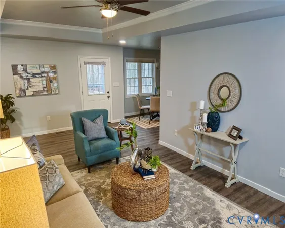 a living room with furniture a clock and a window