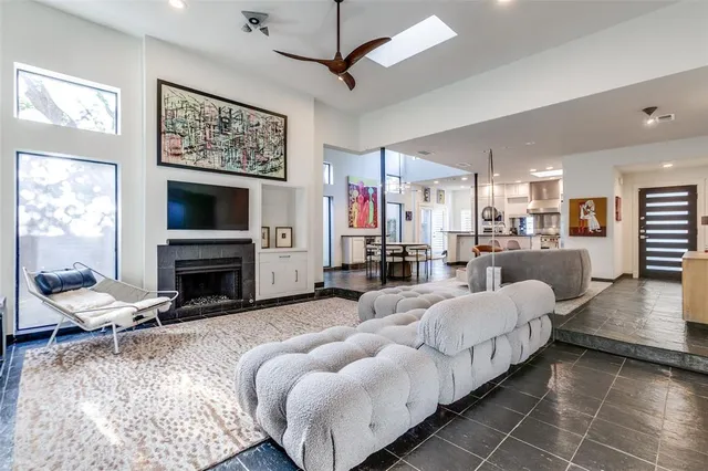 a bedroom with furniture and a fireplace