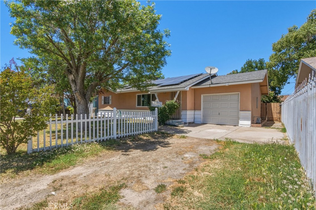 6812 Helton Street Winton, CA 95388 - Photo 2 of 24 a view of a house with a yard and fence