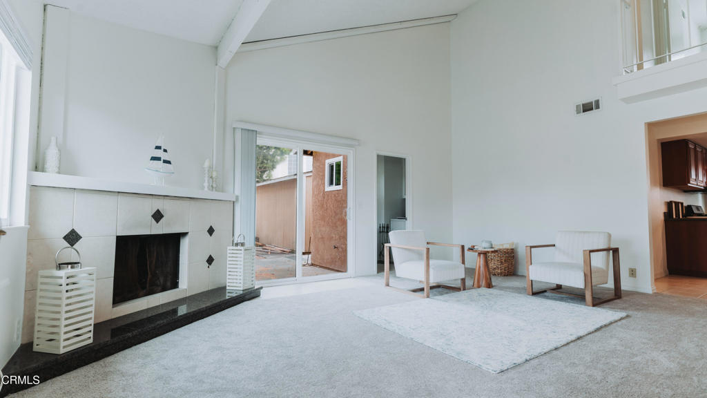 1022 Dunes Street, Unit 1022 Oxnard, CA 93035 - Photo 1 of 68 a living room with furniture and a fireplace