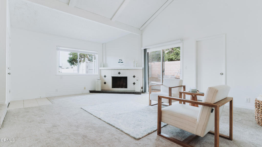 1022 Dunes Street, Unit 1022 Oxnard, CA 93035 - Photo 4 of 68 a view of a livingroom with furniture and a fireplace