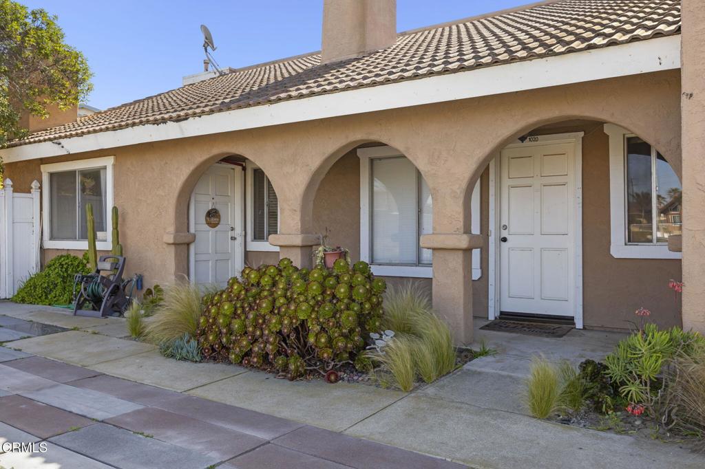 1022 Dunes Street, Unit 1022 Oxnard, CA 93035 - Photo 47 of 68 a front view of a house with garden