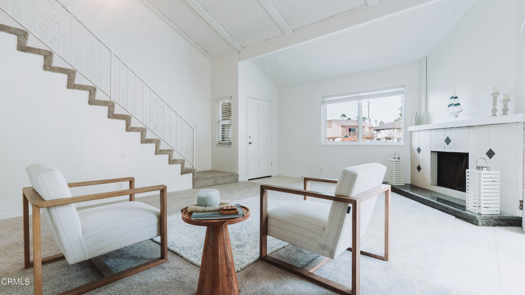1022 Dunes Street, Unit 1022 Oxnard, CA 93035 - Photo 5 of 68 a living room with furniture a fireplace and a painting