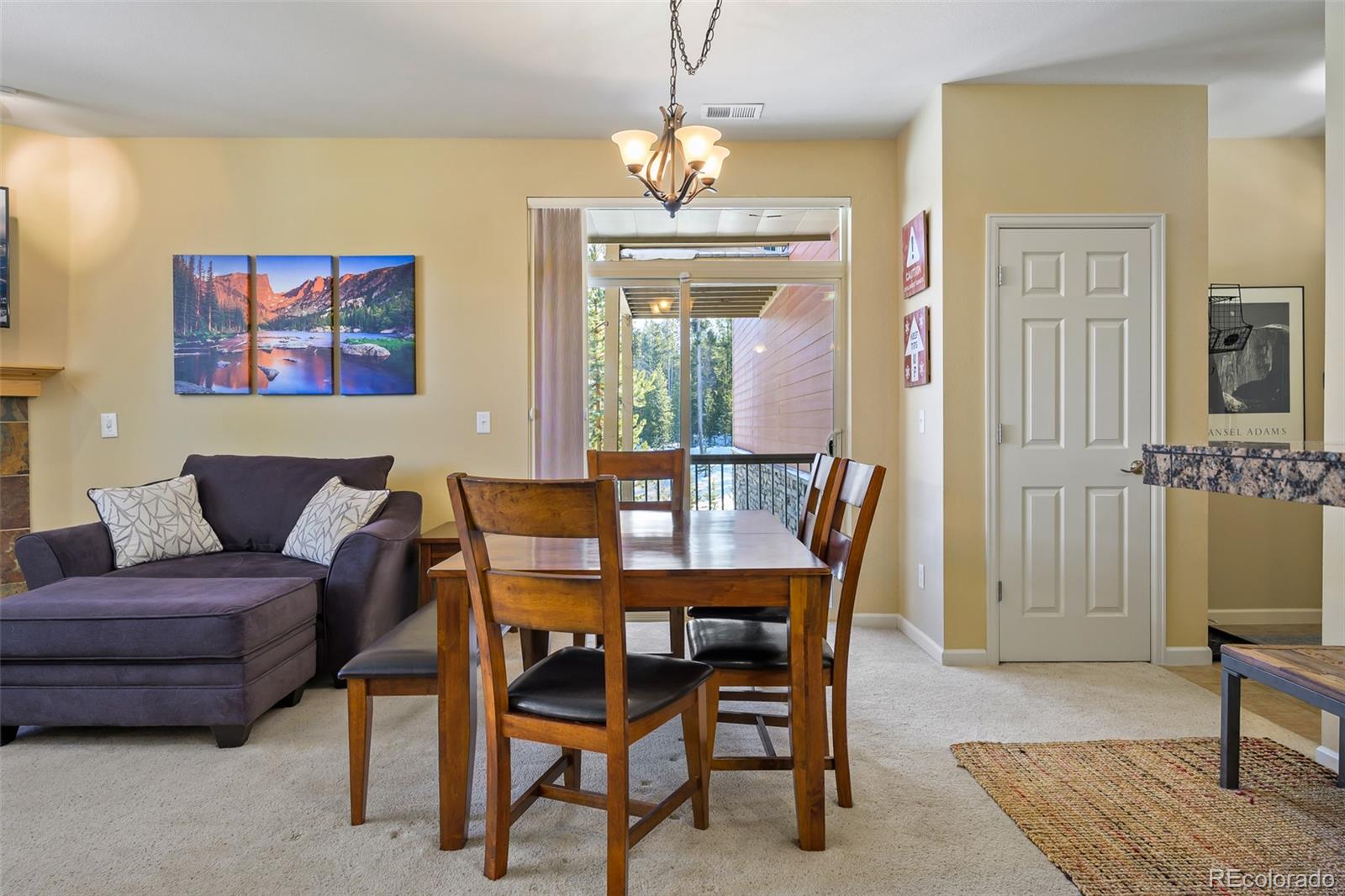 180 County Road, Unit 1 Fraser, CO 80442 - Photo 13 of 37 a dining room with furniture and window