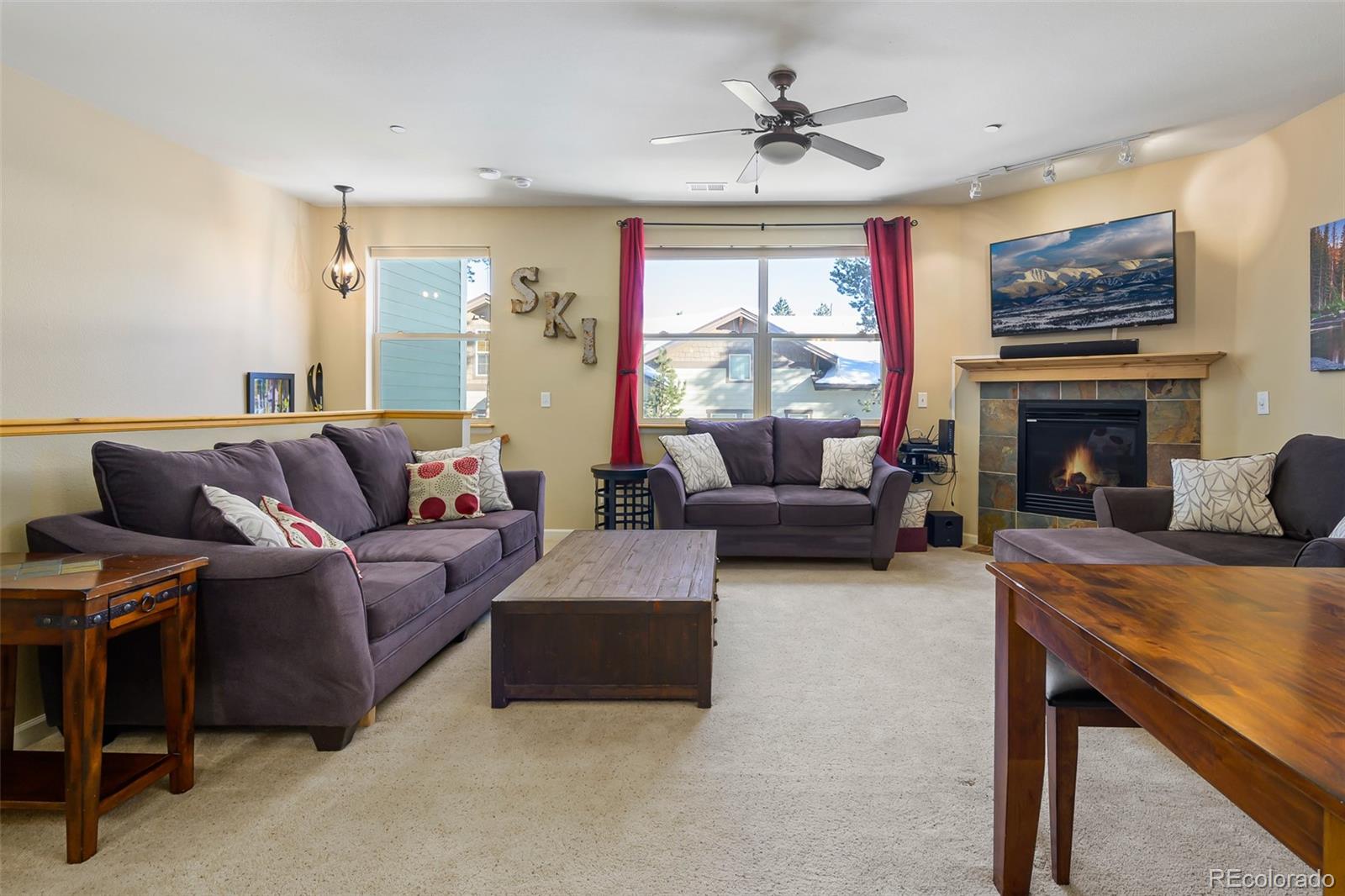 180 County Road, Unit 1 Fraser, CO 80442 - Photo 20 of 37 a living room with furniture and a fireplace