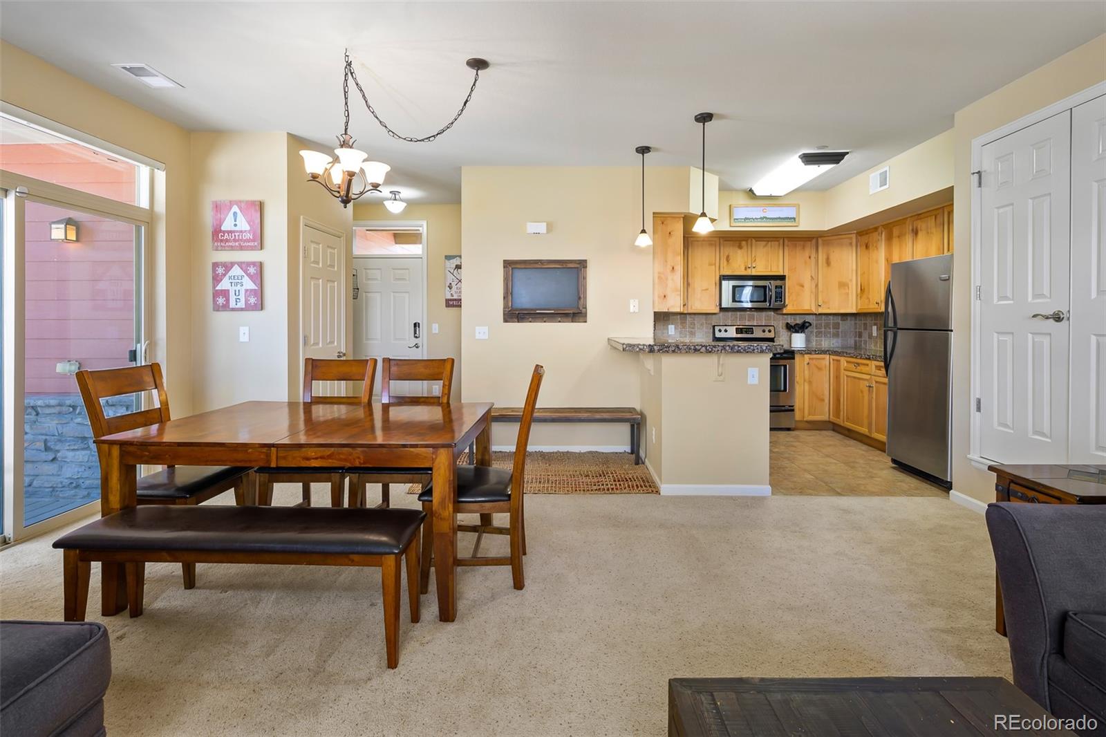 180 County Road, Unit 1 Fraser, CO 80442 - Photo 27 of 37 a large kitchen with a table and chairs