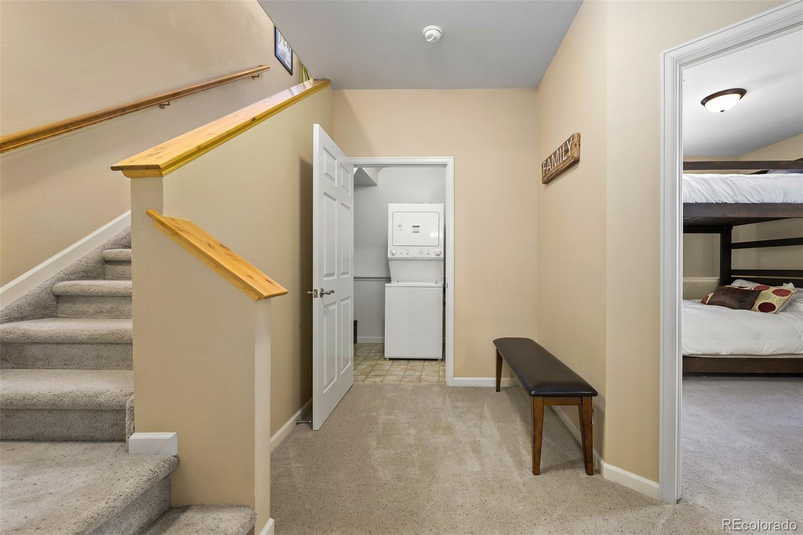 180 County Road, Unit 1 Fraser, CO 80442 - Photo 30 of 37 a view of a livingroom with furniture and stairs
