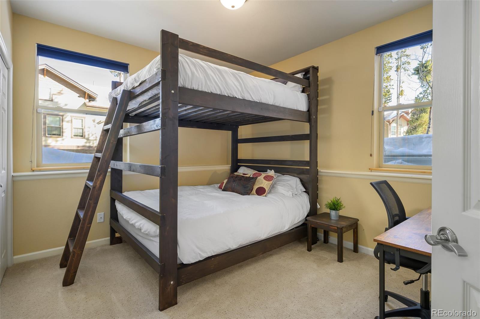 180 County Road, Unit 1 Fraser, CO 80442 - Photo 34 of 37 a bed room with a bed and a chair