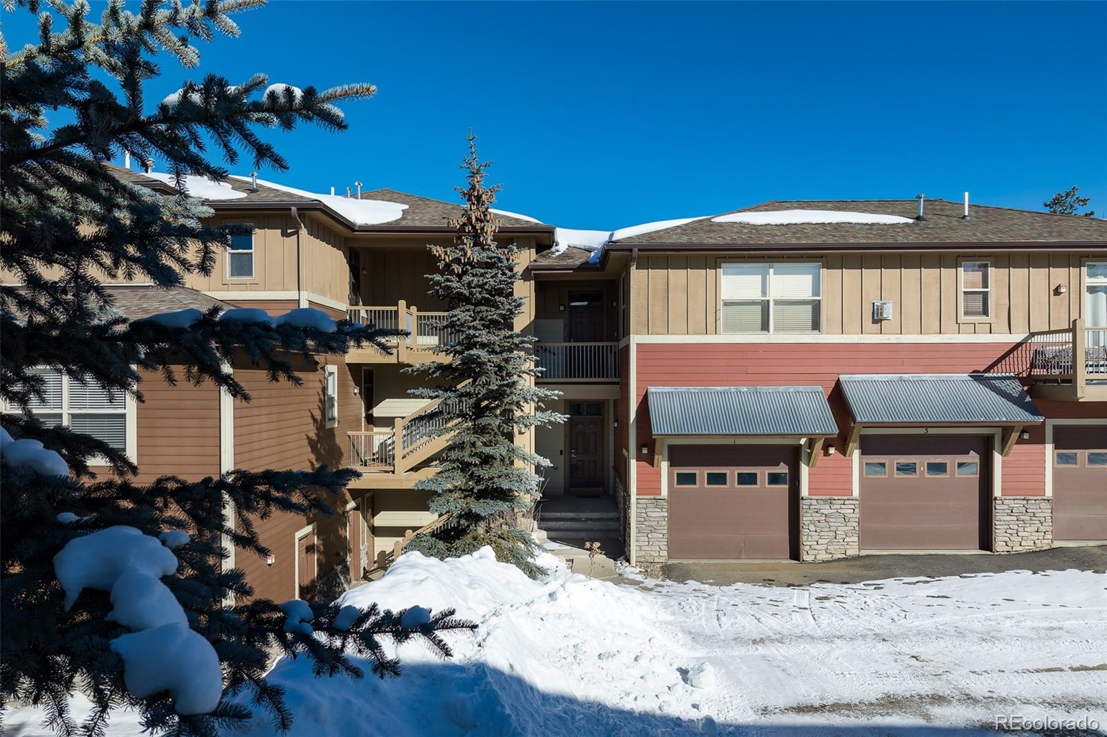 180 County Road, Unit 1 Fraser, CO 80442 - Photo 4 of 37 a front view of a house with a yard