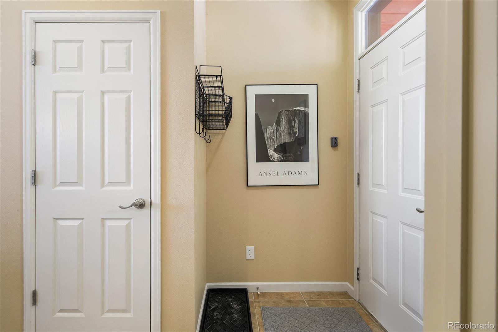 180 County Road, Unit 1 Fraser, CO 80442 - Photo 10 of 37 a view of a hallway with wooden floor and entryway