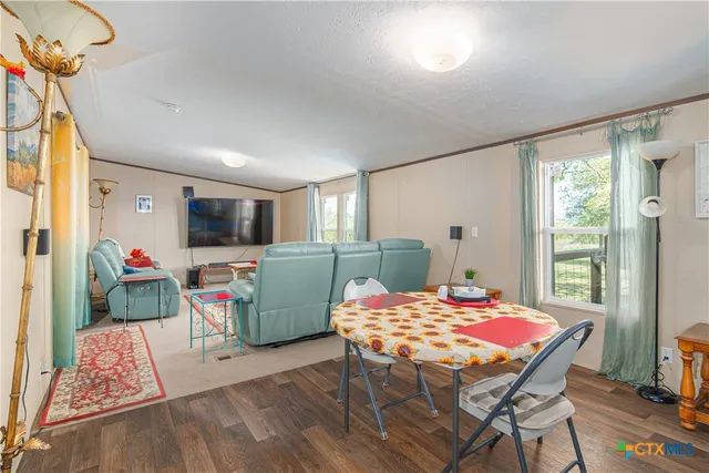 a outdoor space that has a table and chairs in it