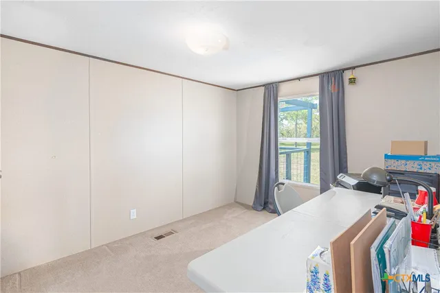 a room with a bed and a window