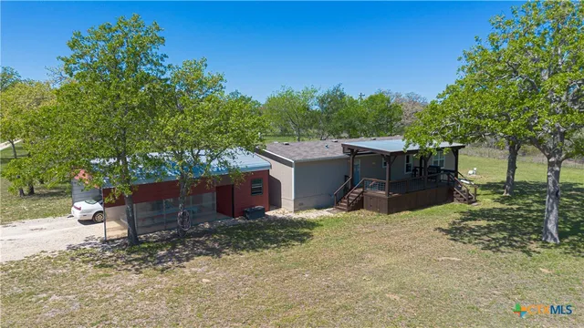 a view of a yard with an outdoor space
