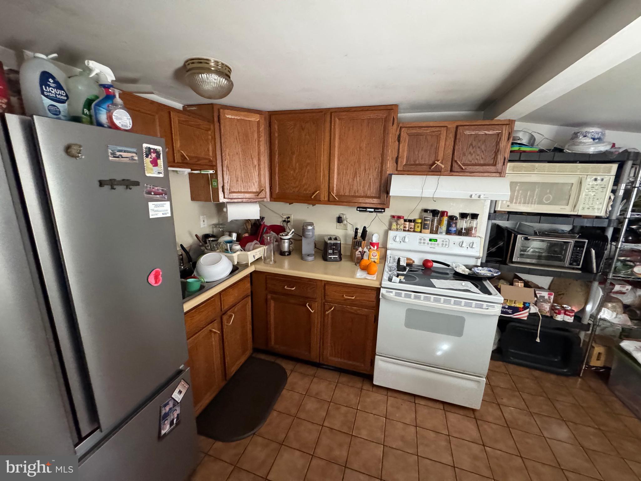 200 West Buckshutem Road Millville, NJ 08332 - Photo 5 of 10 a kitchen with a refrigerator and a sink